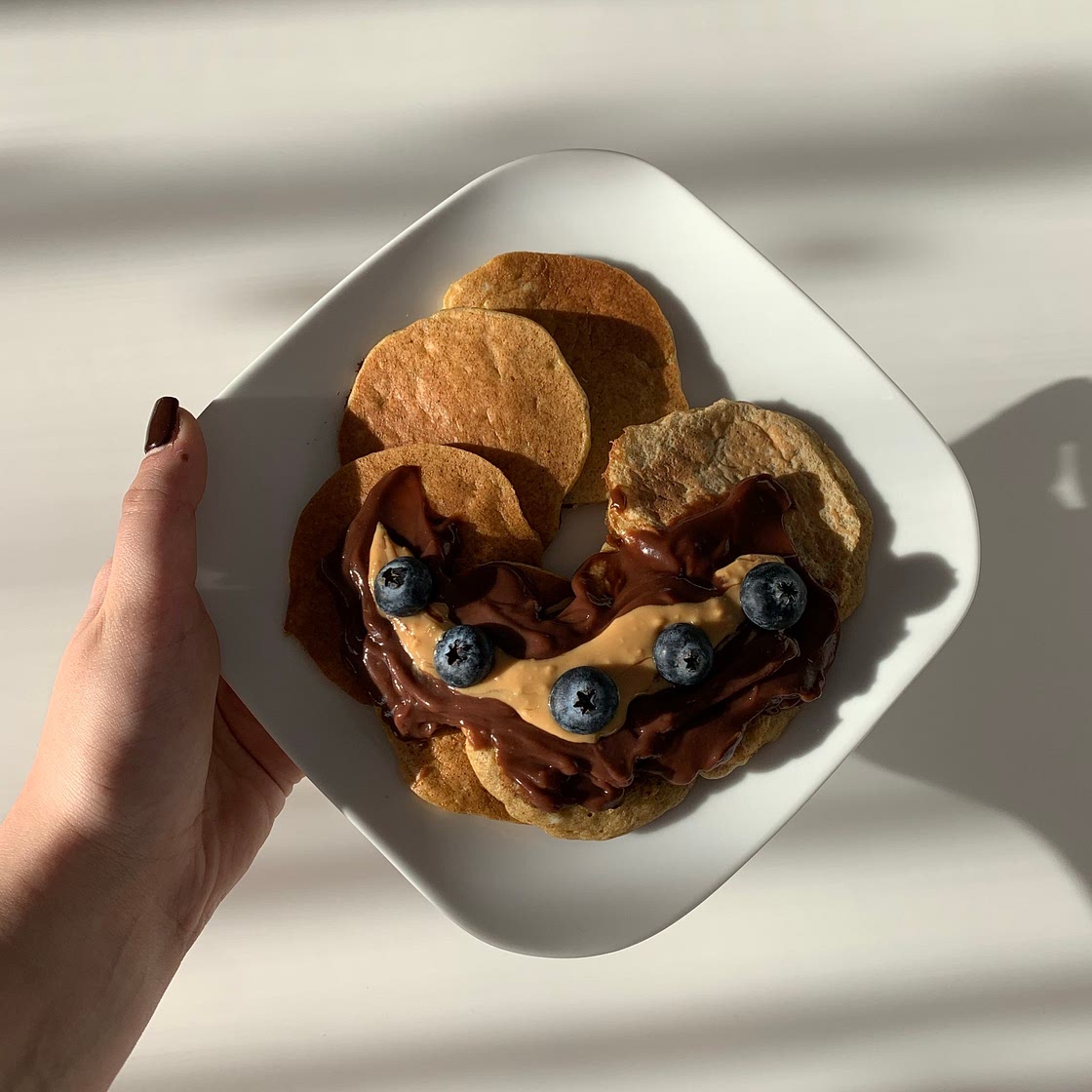 Banana pancakes with coconut pudding and peanut butter 