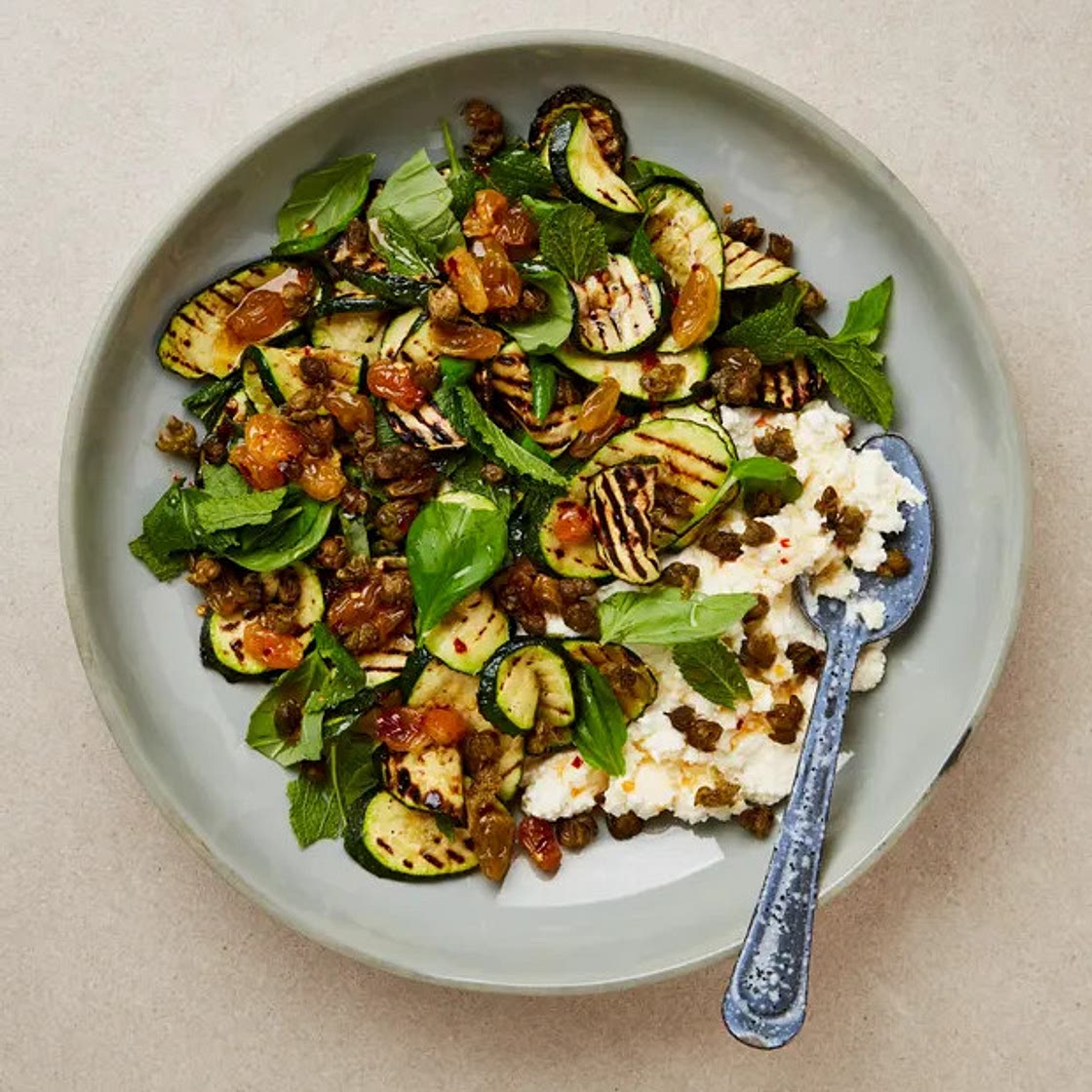 Grilled courgettes with garlic ricotta, raisin agrodolce and crisp capers