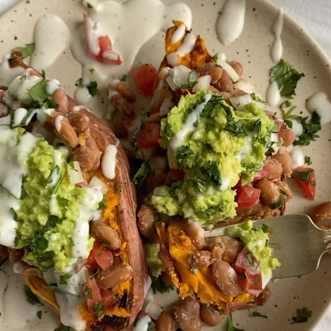 think nachos…. but on a potato? sounds weird but it’s SO GOOD lol recipe is below 🤓 cut sweet potato in half, coat in olive oil, &amp; bake at 400F for 30 minutes then add toppings of choice (i did cooked pinto beans, pico, guac, vegan sour cream, &amp; c