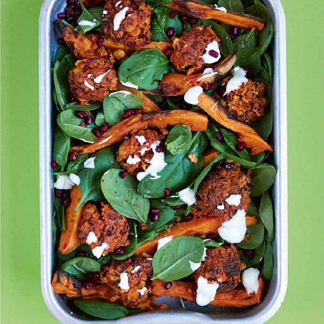CANNELLINI BEAN FALAFEL WITH POTATO WEDGES, SPINACH & POMEGRANATE