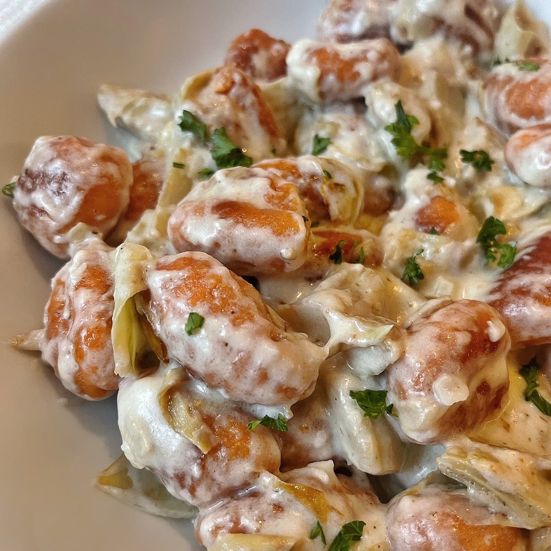 Sweet Potato Gnocchi with Creamy Garlic Parmesan Sauce and Crispy Artichokes