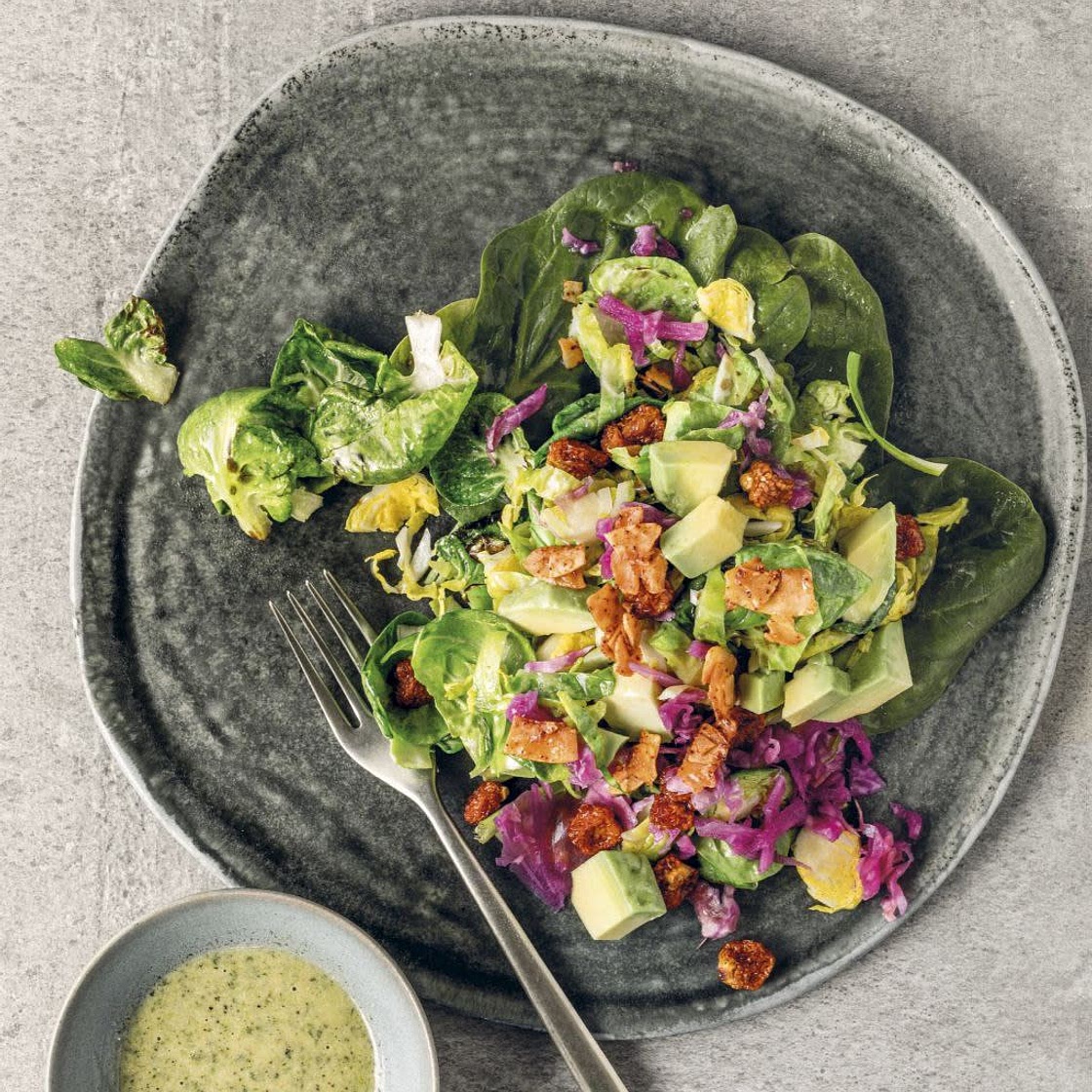 Warm Brussels Sprouts Salad with Capers, Coconut Bacon, and Hempseed Ranch Dressing