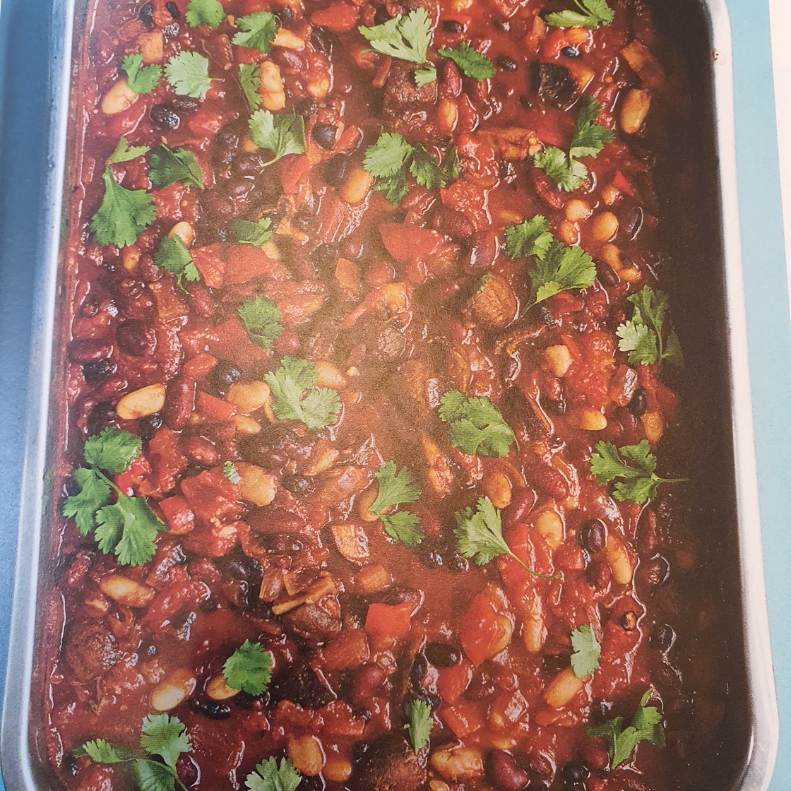 Three bean chilli with avocado salsa