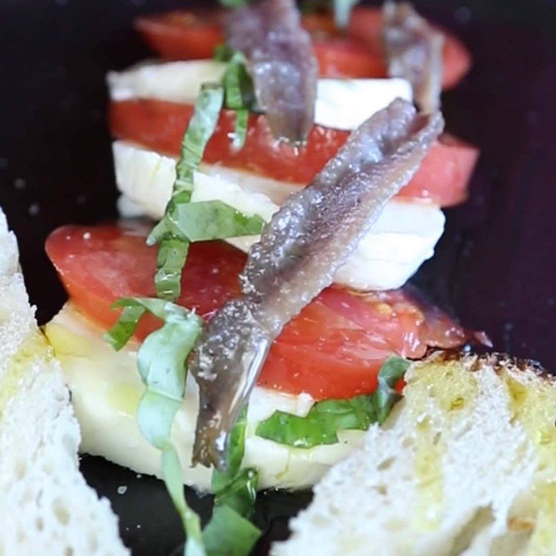 Healthy fresh caprese and anchovies lunch 
