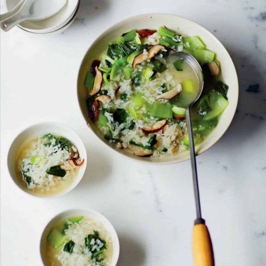 Soupy rice with chopped greens