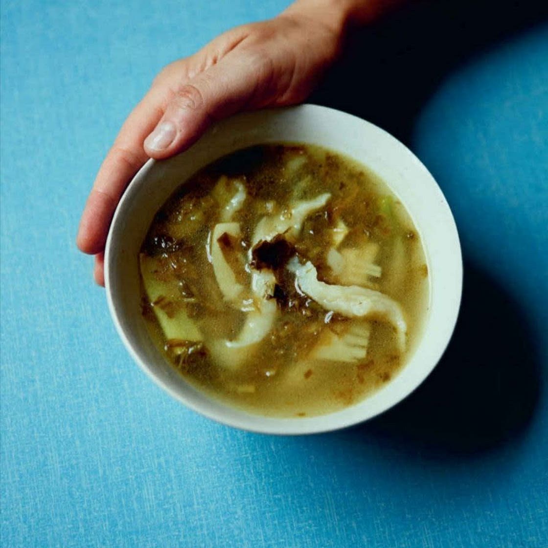 Rustic dough-wriggle soup with pickled greens