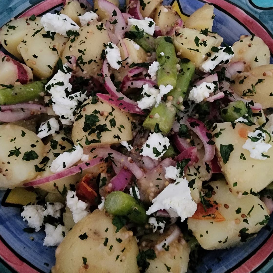 Warm Potato salad with asparagus, semi sundried tomatoes & goats cheese