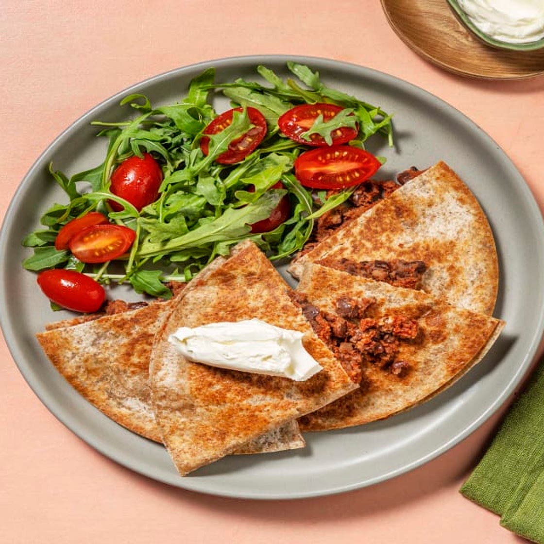 Cheesy Chipotle Bean Quesadillas with Tomato & Rocket Salad and Soured Cream