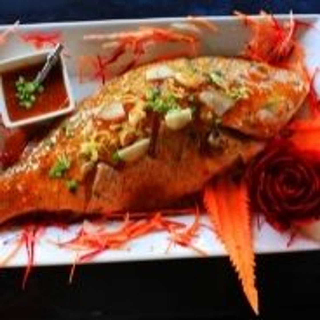 Baked snapper on its bed of potatoes