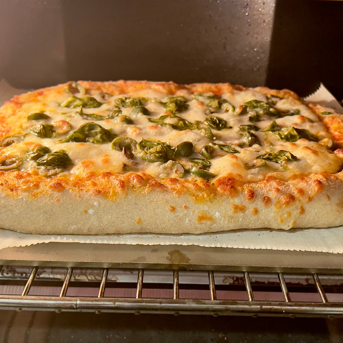 Sourdough Pizza with Olives and fresh Basil