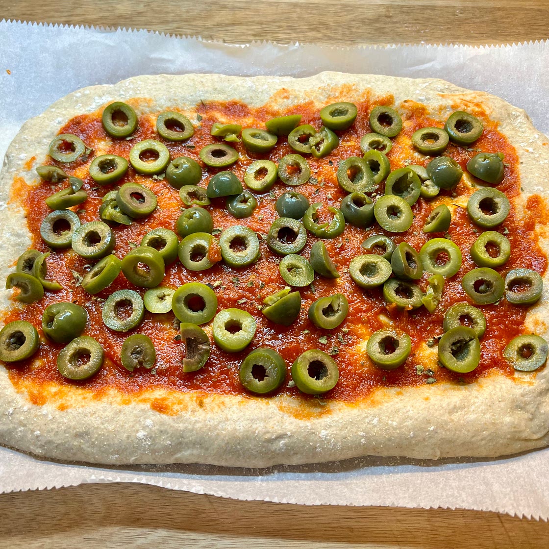 Sourdough Pizza with Olives and fresh Basil