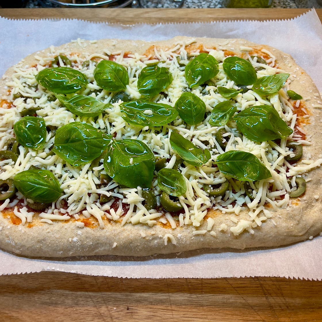 Sourdough Pizza with Olives and fresh Basil