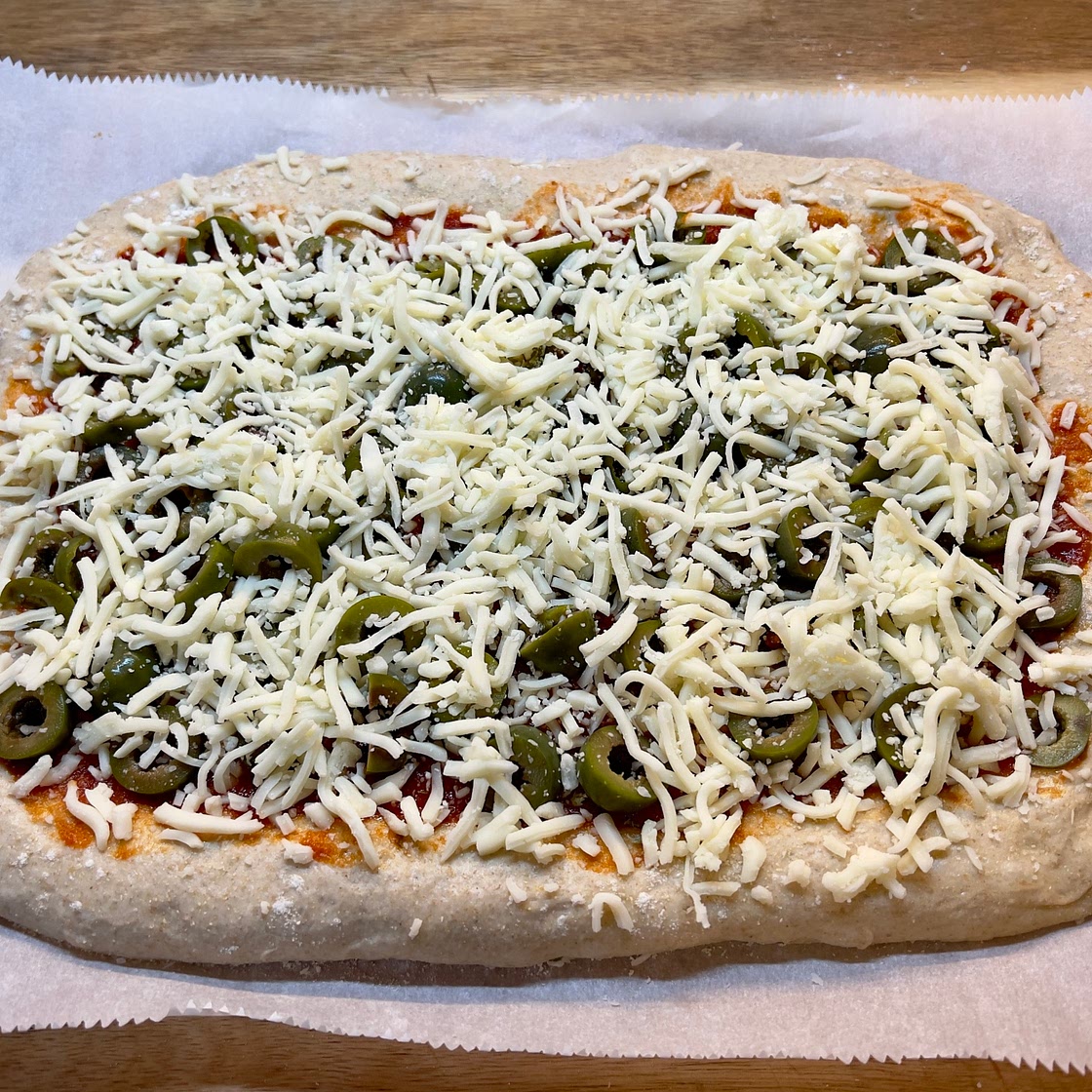 Sourdough Pizza with Olives and fresh Basil