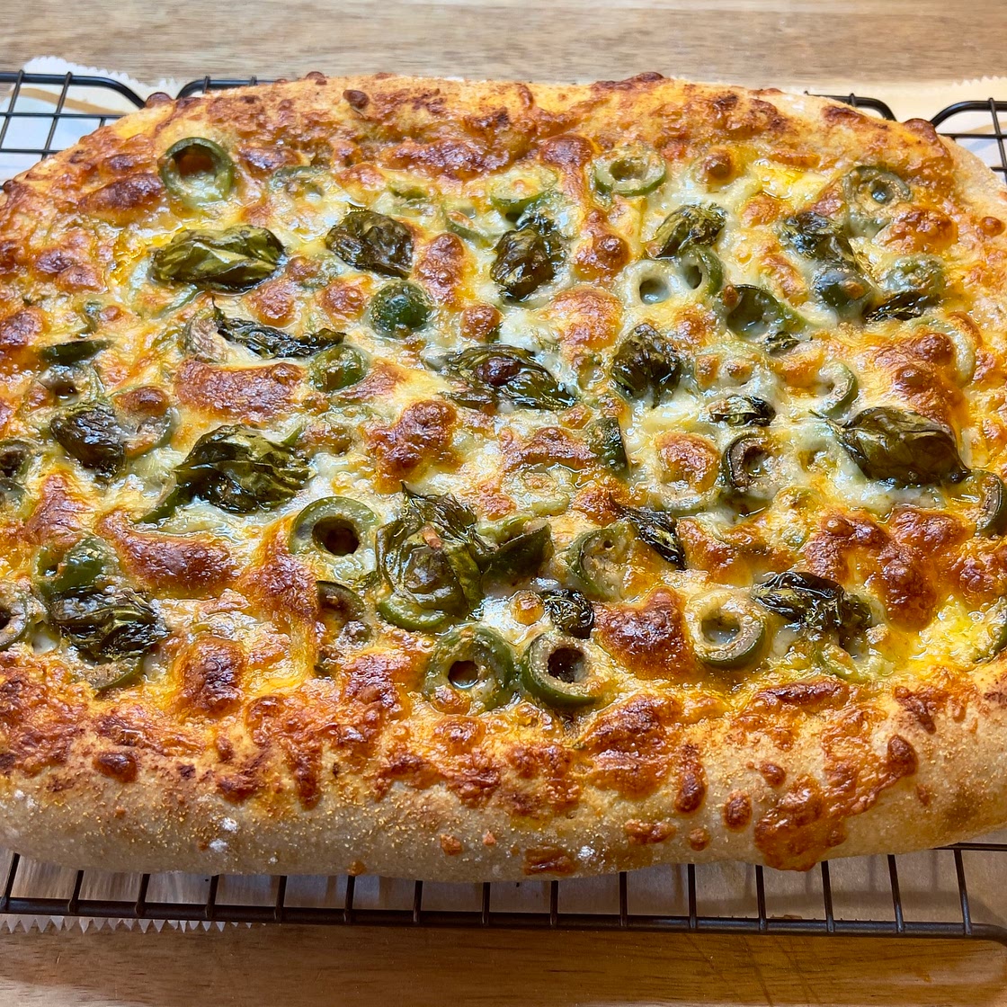 Sourdough Pizza with Olives and fresh Basil
