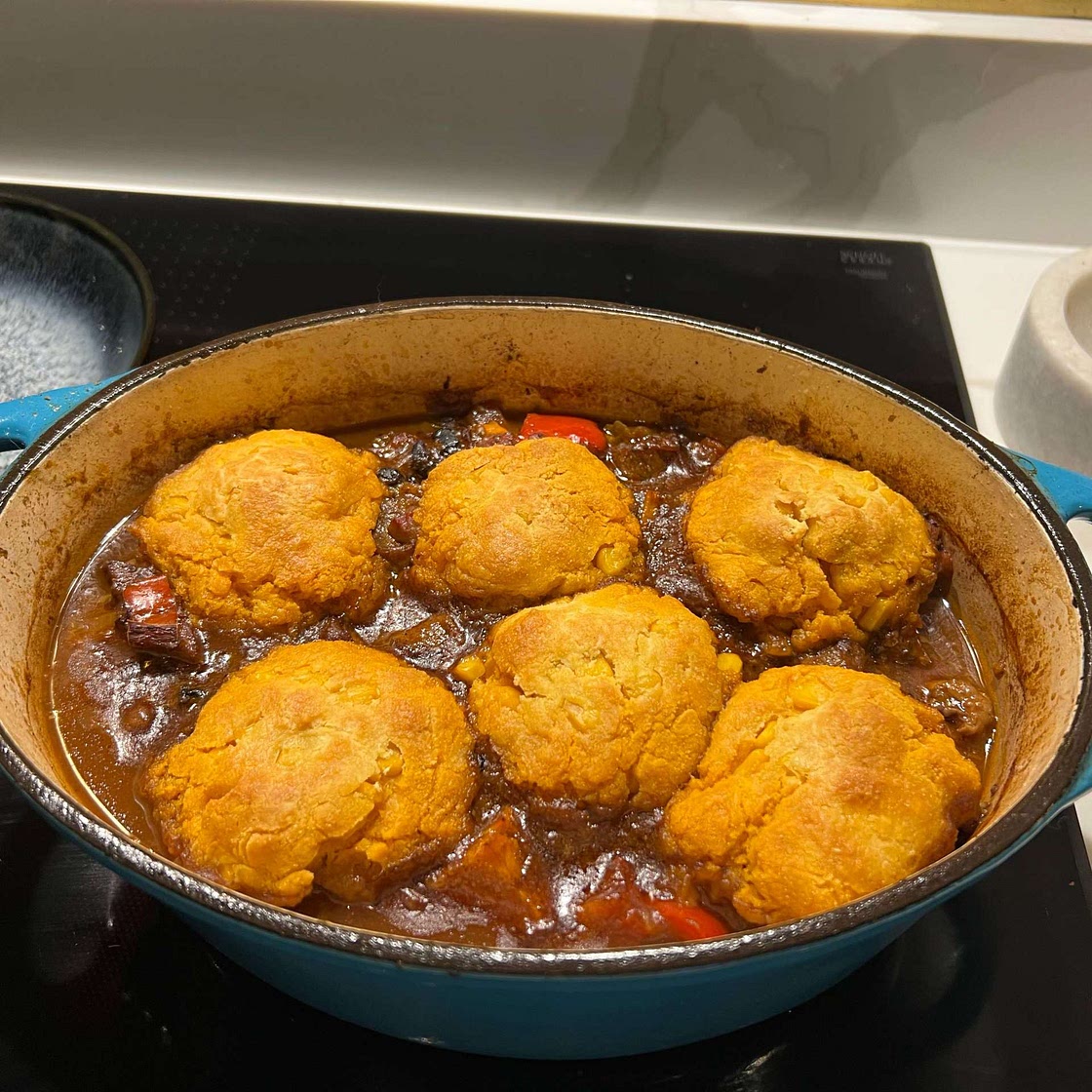 Brazilian pork stew with corn dumplings