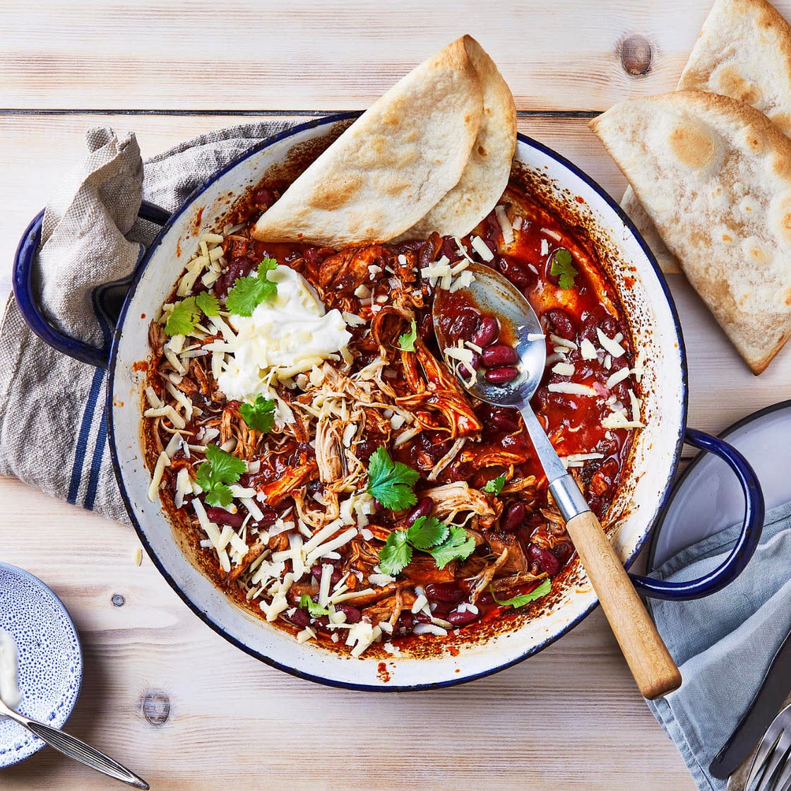 Shredded chicken chilli with warm tortillas