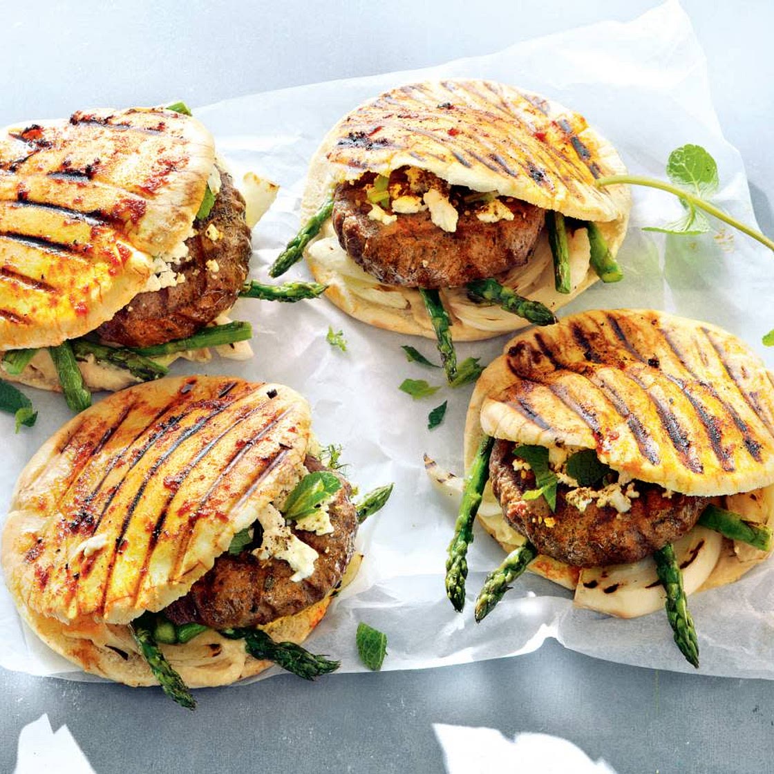 Hamburger with grilled vegies, hummus and feta