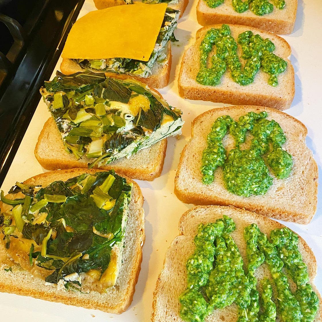 Steamed egg sandwich with spinach, cheddar and aji verde sauce
