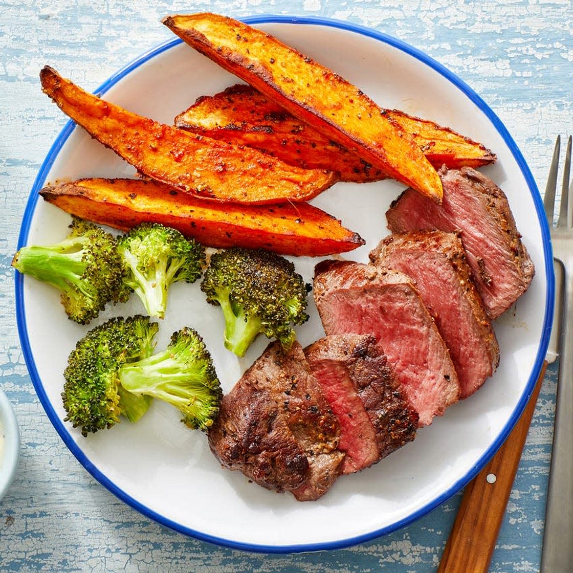 Steak with sweet potato fries and broccoli