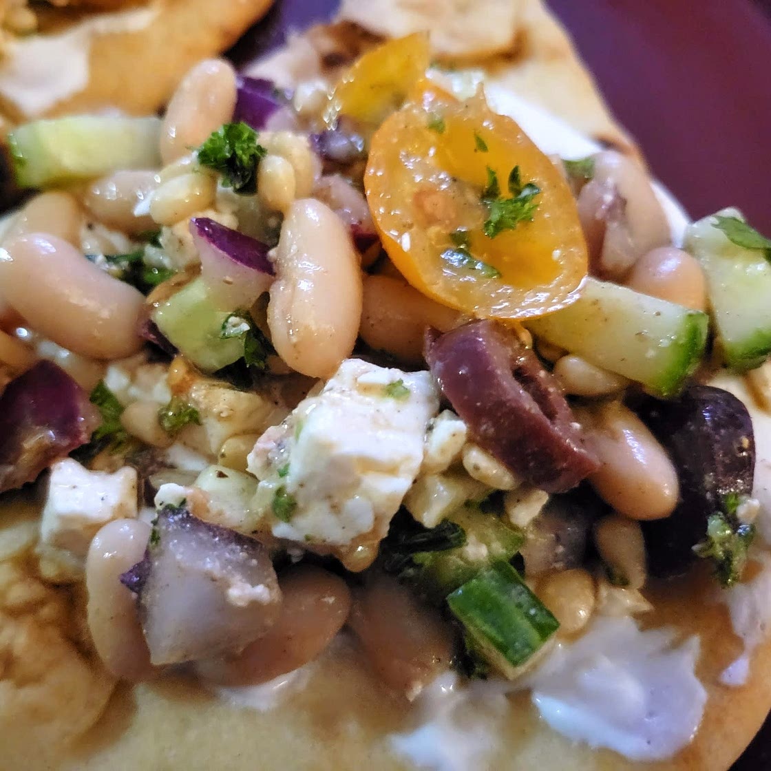 Greek salad wraps with white beans and garlic yogurt