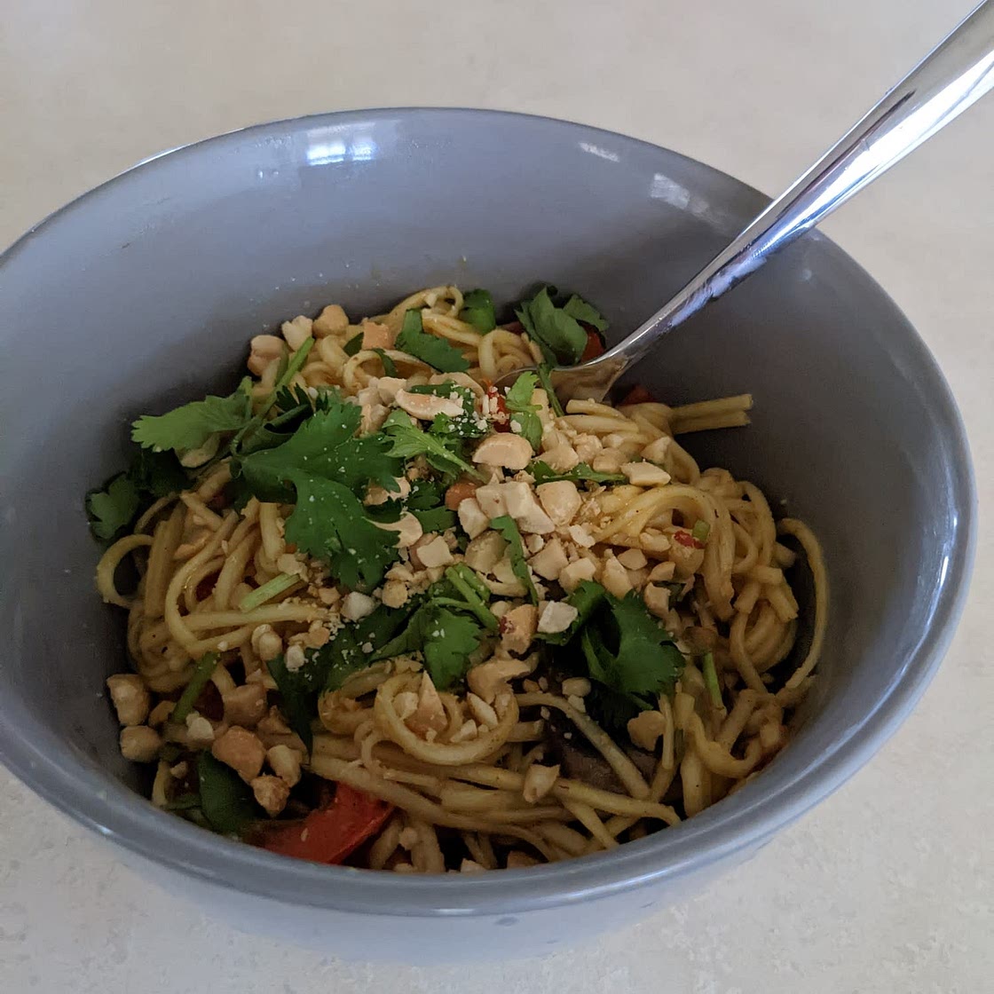 One-Pot Spicy Coconut Curry Stir-Fry with Noodles, Cilantro & Peanuts