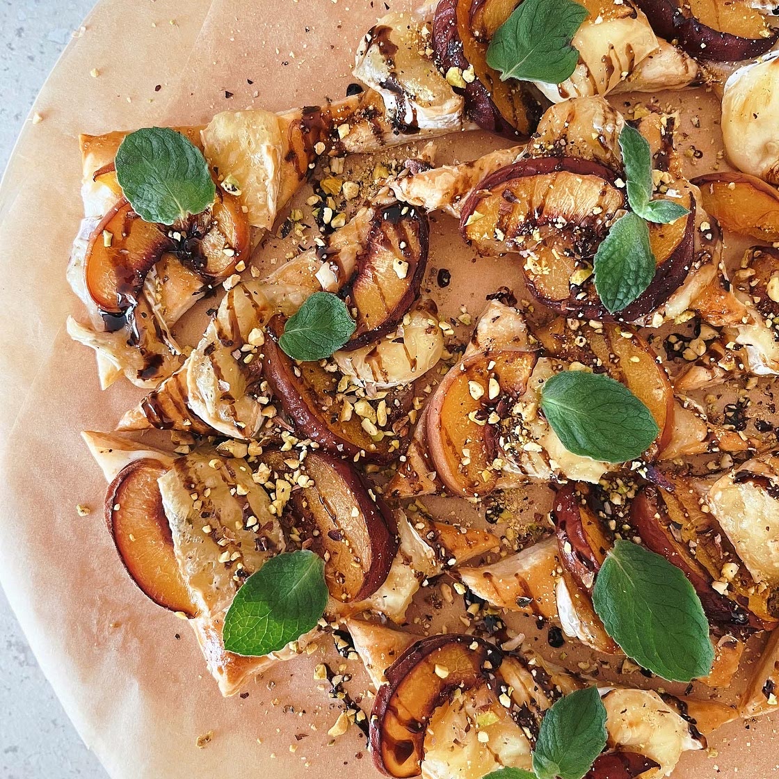 Puff pastry pies with brie, camembert, and peaches