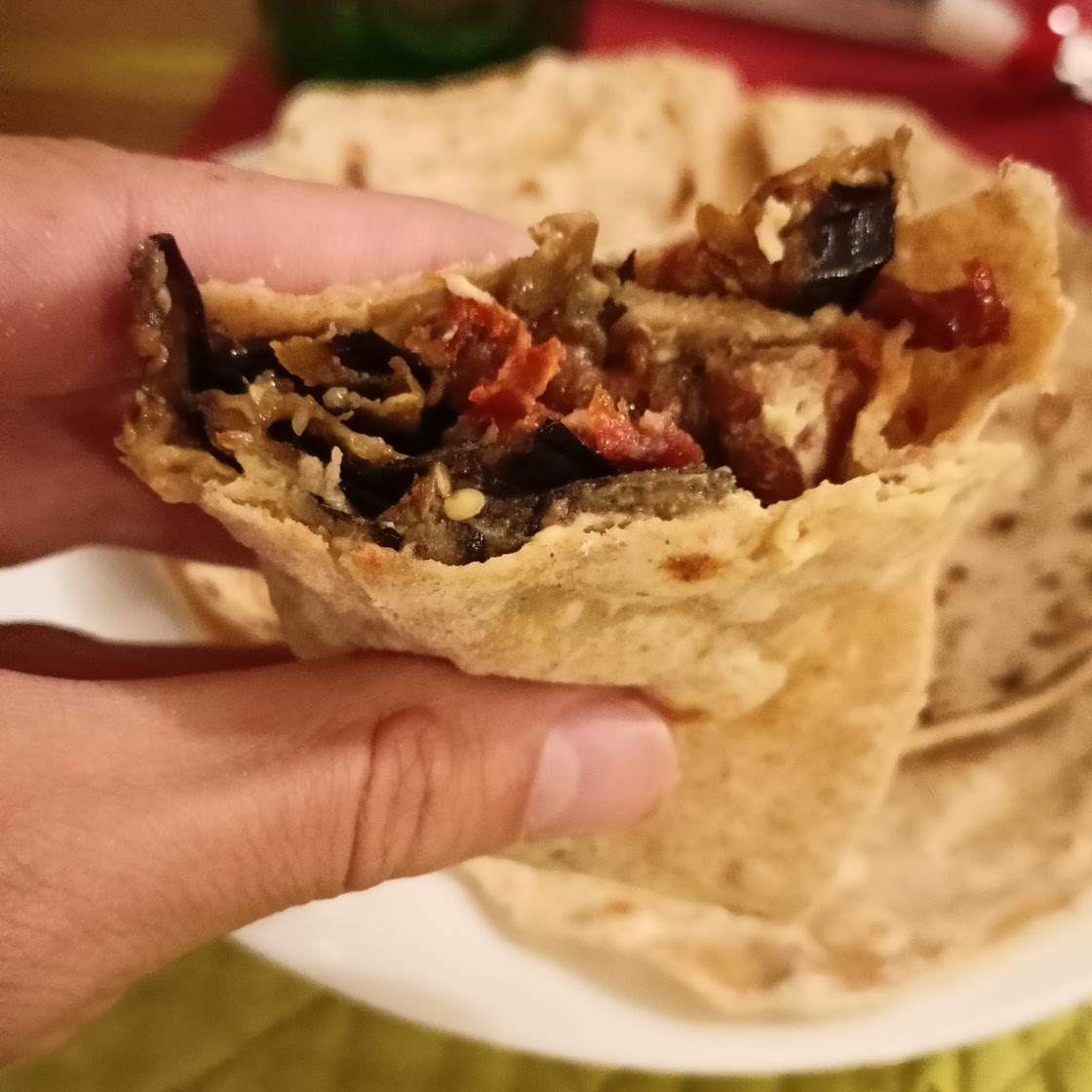 Piadine with hummus, beans, dried tomatoes and aubergines