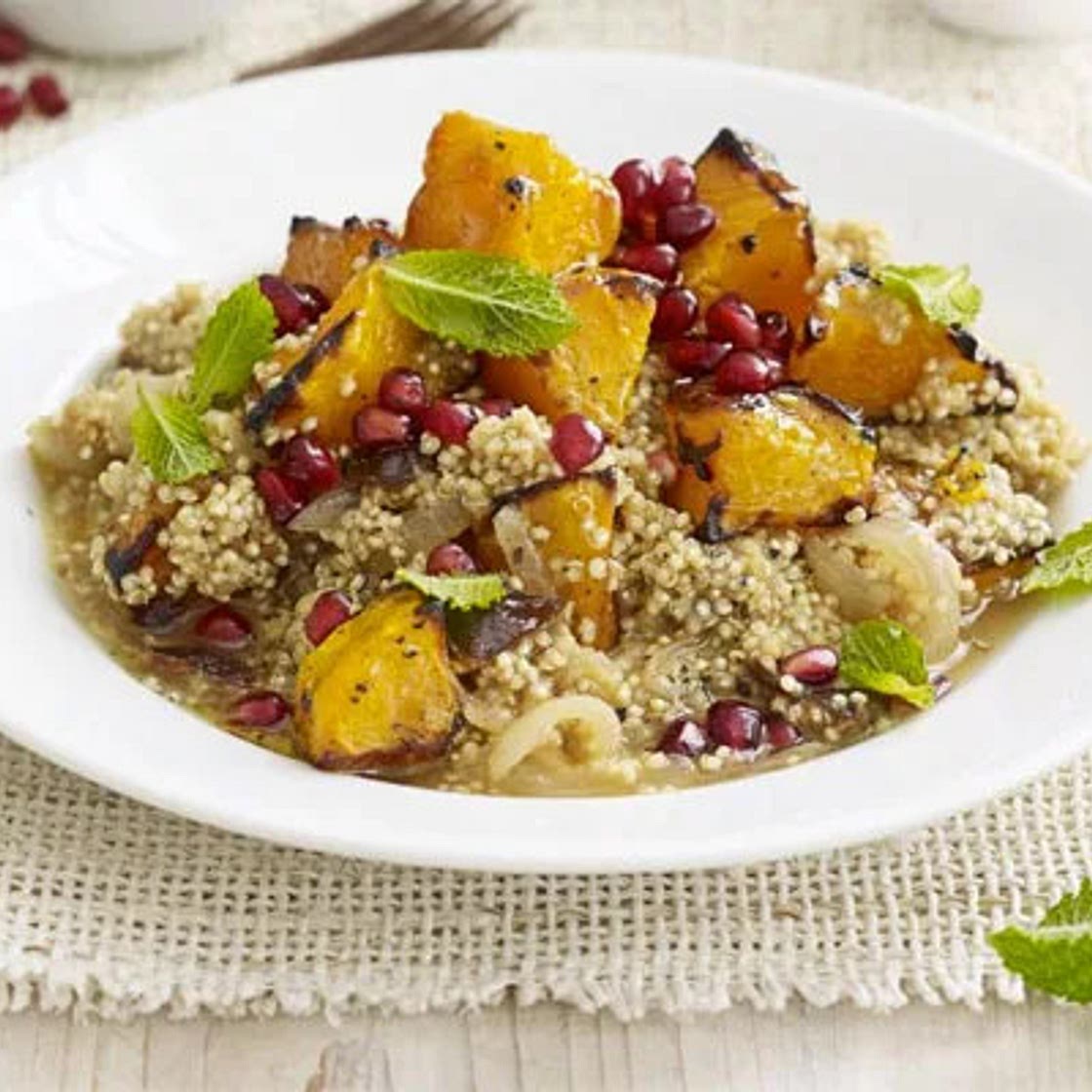 Quinoa stew with squash, prunes & pomegranate