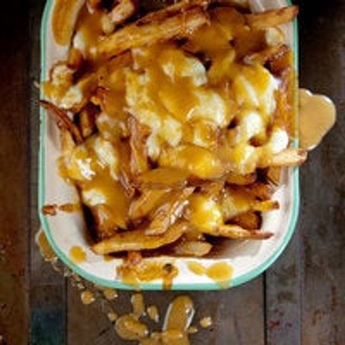 Poutine (French Fries with Gravy and Cheese Curds)