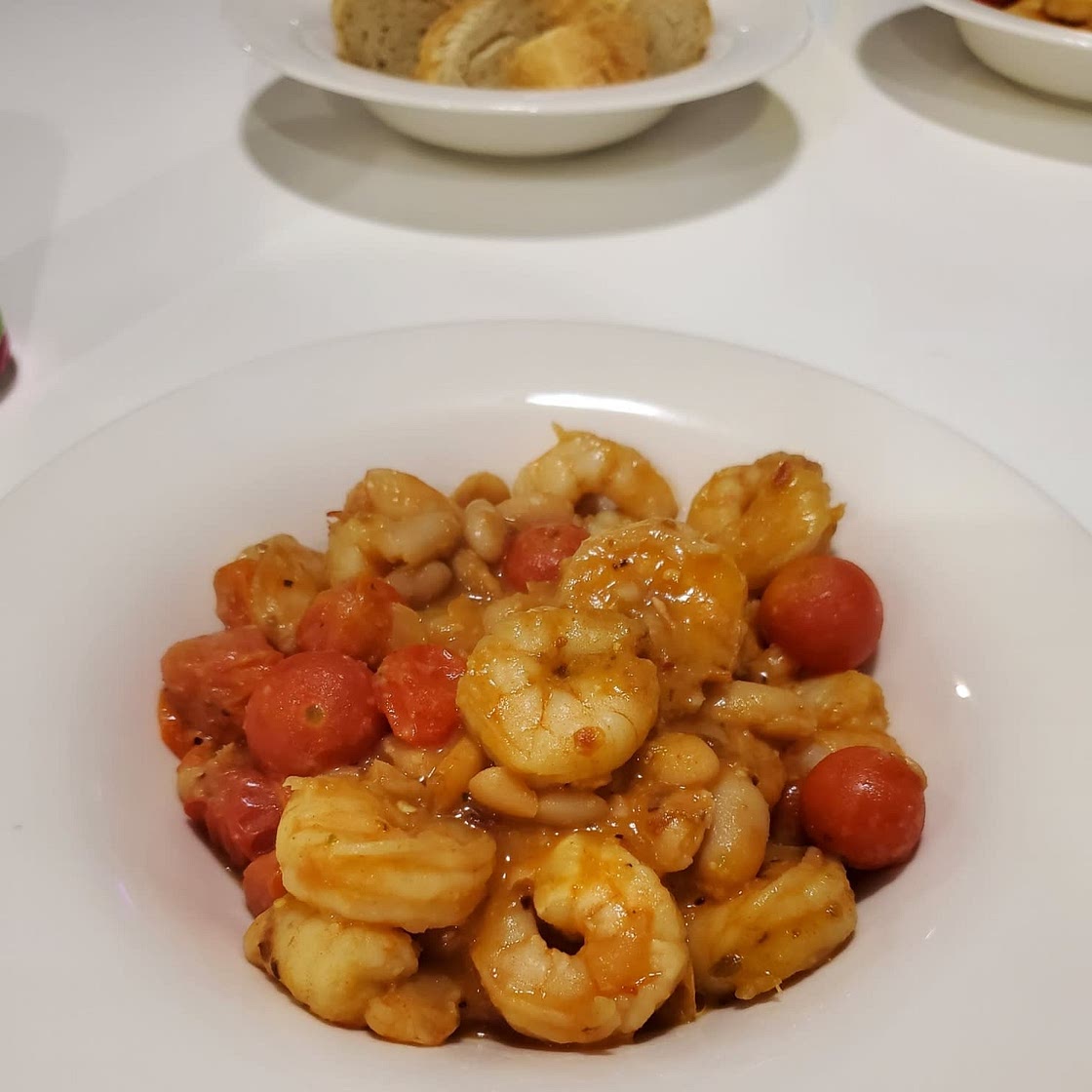 Garlicky Sautéed Shrimp with Creamy White Beans and Blistered Tomatoes