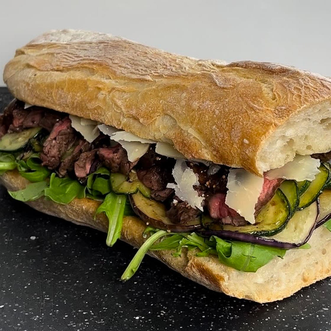 Steak and grilled vegetables sandwich