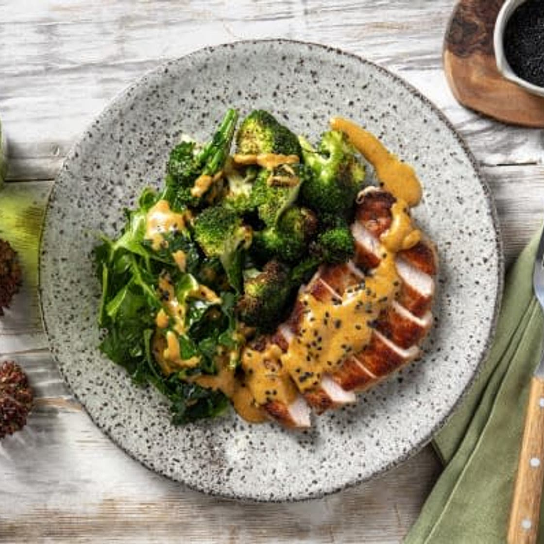 Satay Inspired Pork Loin Steak
with Garlic Broccoli and Sesame Seeds