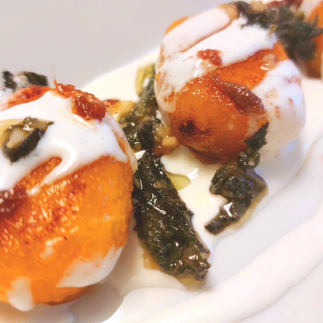 Pumpkin gnocchi with burrata, sage pesto and anchovies.