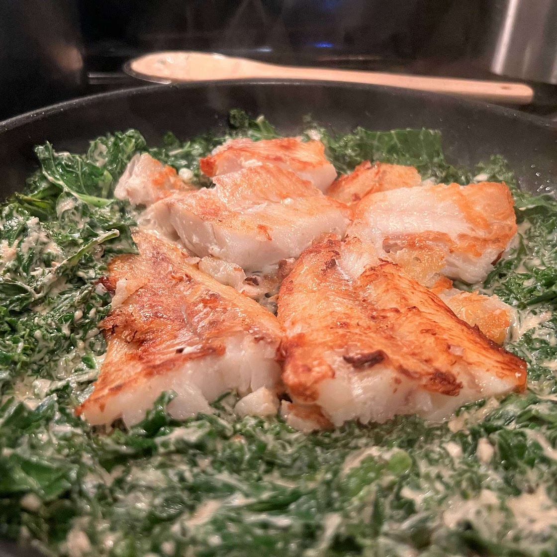 Fish and Kale in Tahini Sauce with crispy shallots