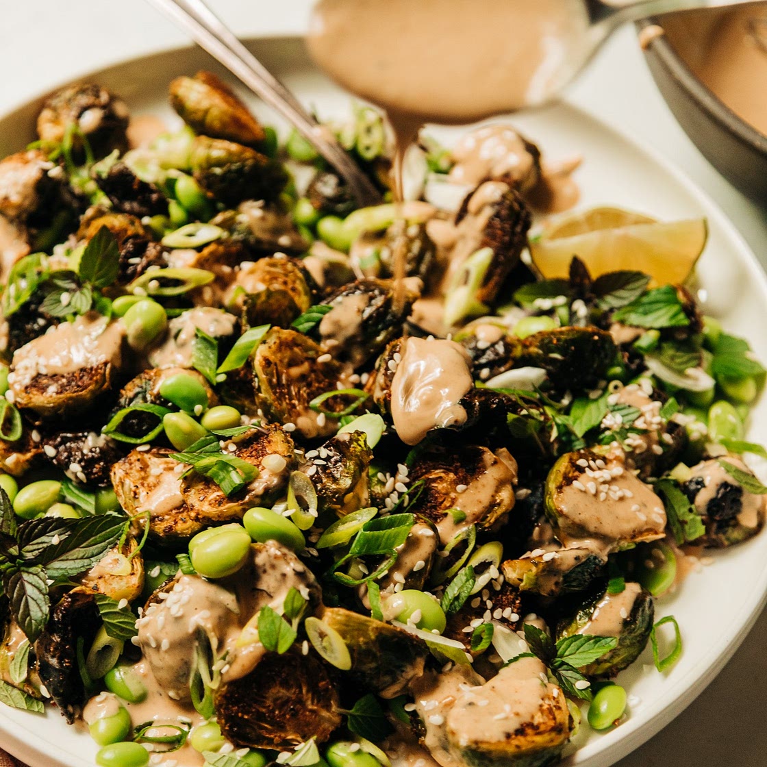 Crispy Roasted Brussels Sprouts with Edamame & Peanut Sauce