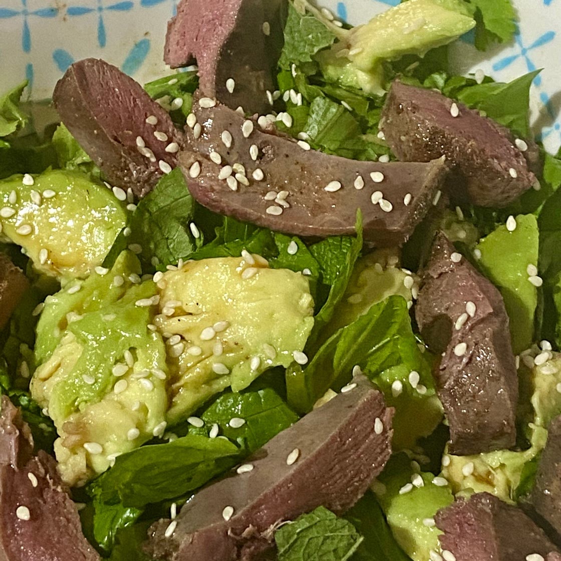 Five Spice Pigeon Breast on a Asian Herb Salad tossed in a Hoisin Dressing