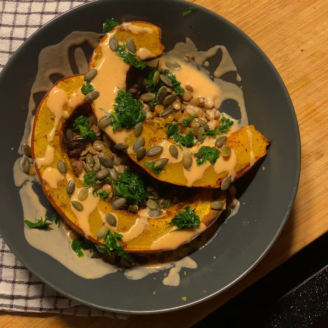 Baked pumpkin with lentils and sriracha yogurt