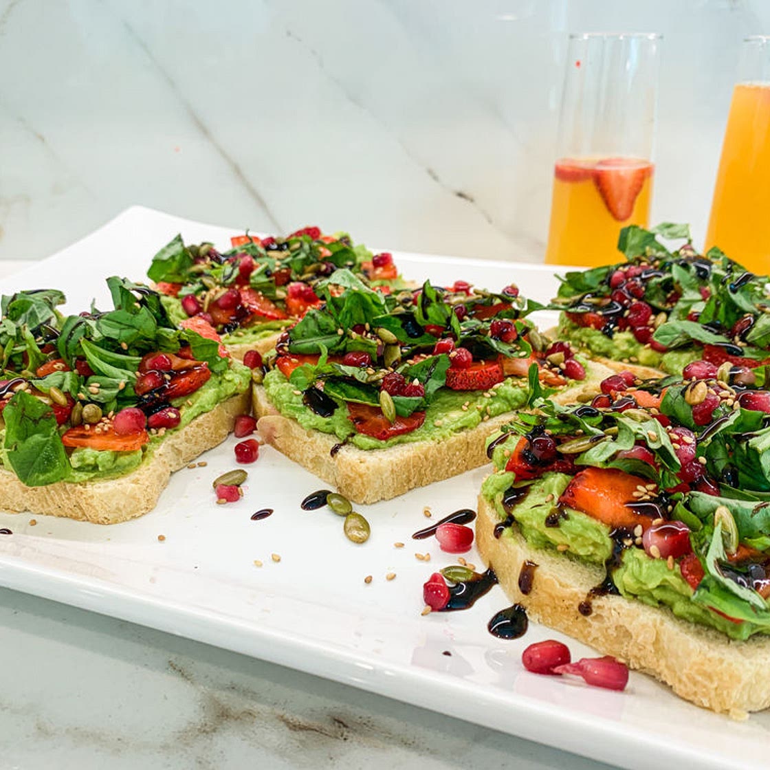 AVOCADO TOAST WITH STRAWBERRIES AND POMEGRANATES