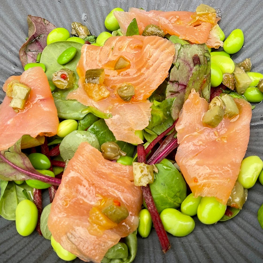 Smoked Trout on an Edamame Bean Salad topped with a Preserved Lemon and Caper Salsa