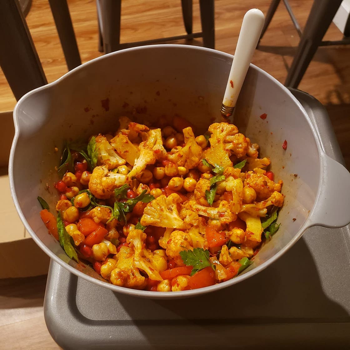 Warm spiced cauliflower and chickpea salad with pomegranate seeds