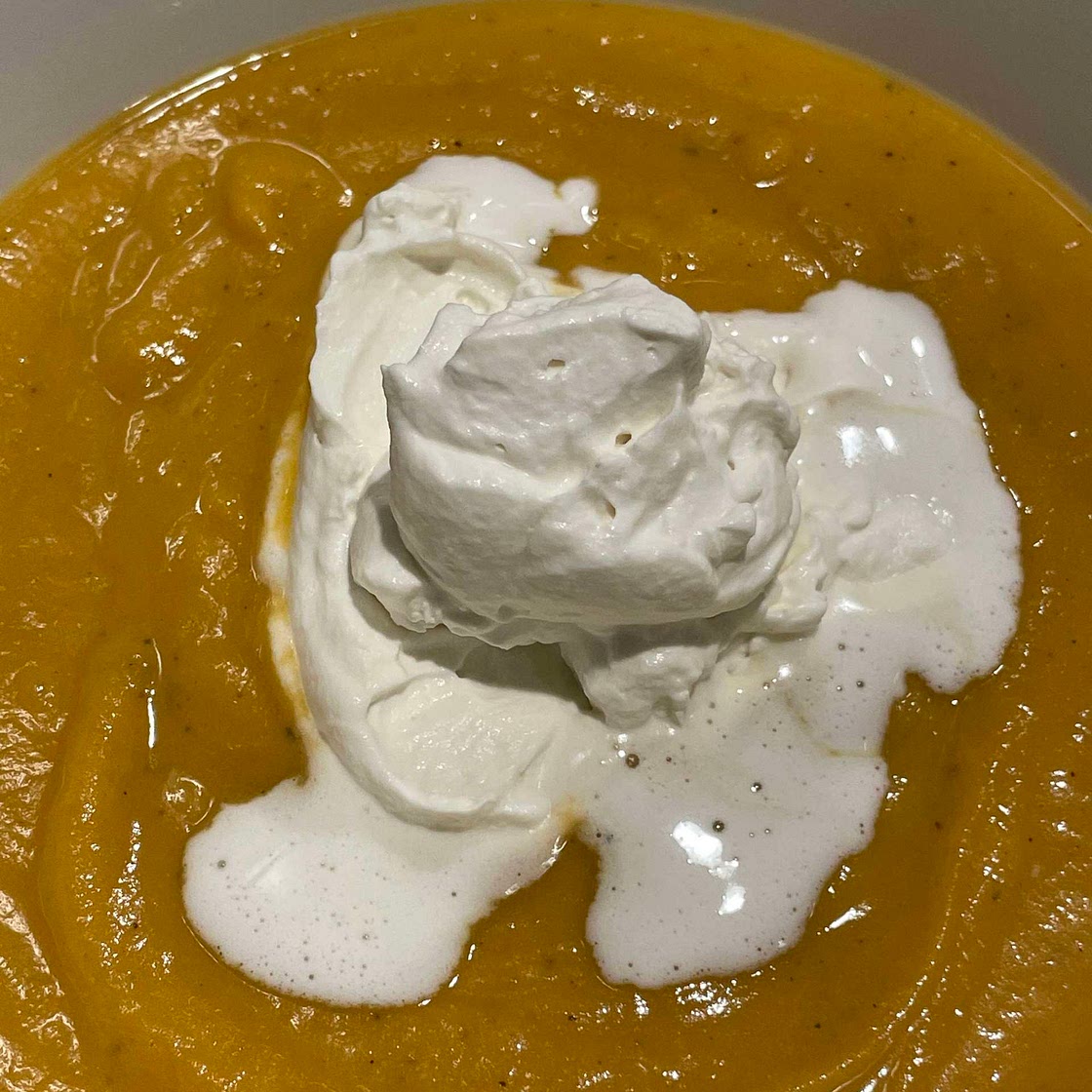 Sweet potato soup with rum cream