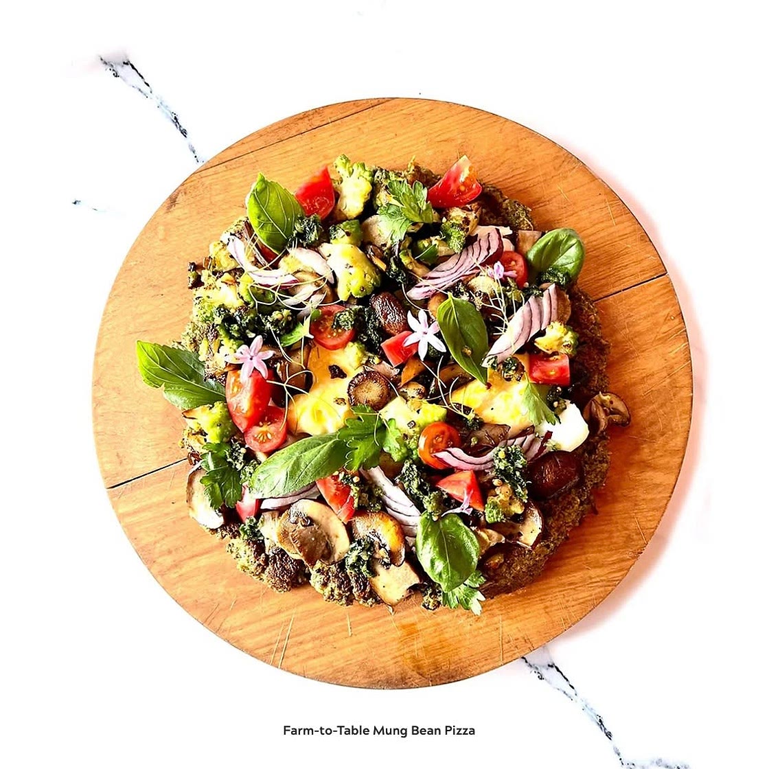 Mung Bean Pizza Toppings of Sauteed Spinach, Oyster Mushroom, Heirloom Tomato,  Kale Sesame Seeds Walnut Pesto