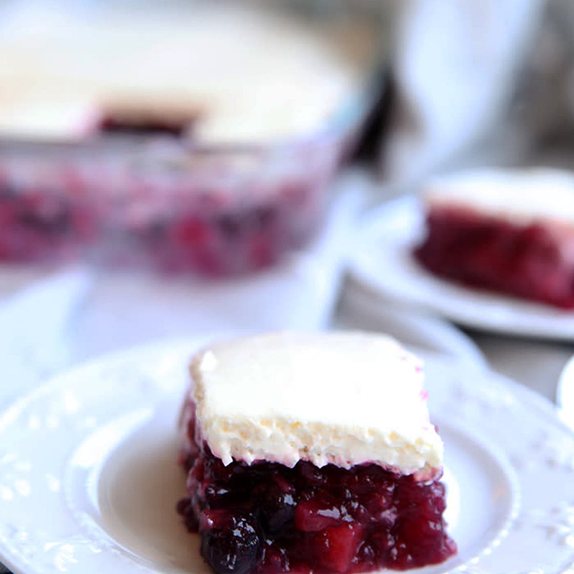 Holiday Cranberry pineapple jello with whipped cream cheese topping