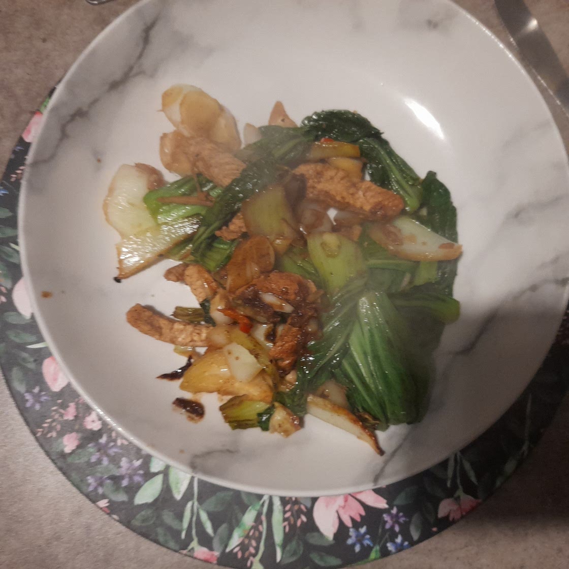 Spicy ginger and garlic pork with pak choi