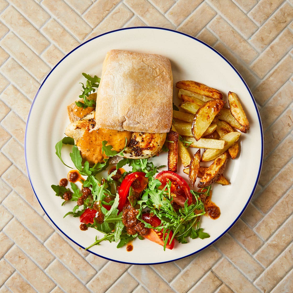 Chicken & red pesto ciabatta with chips and rocket