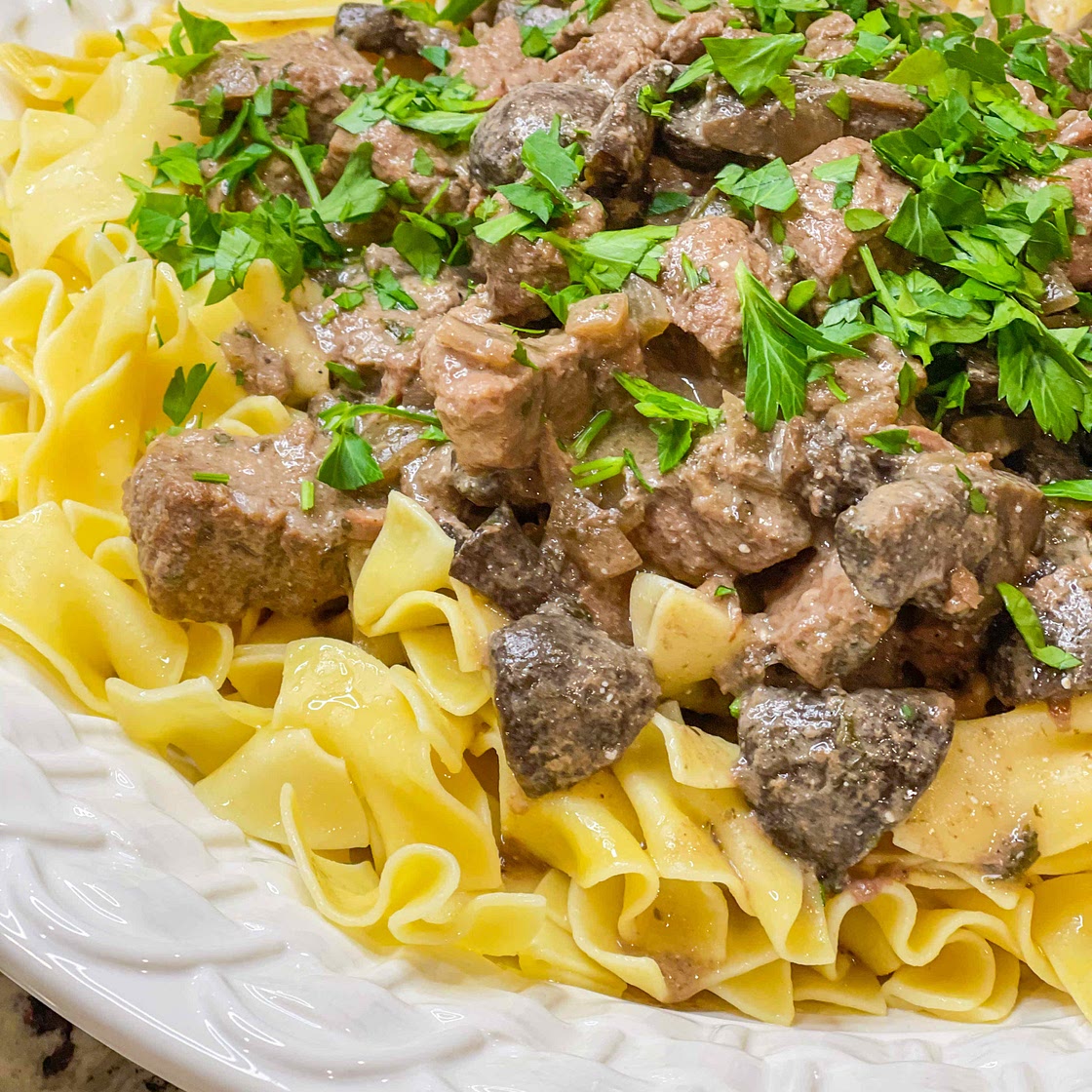 Crockpot beef stroganoff over egg noodles 