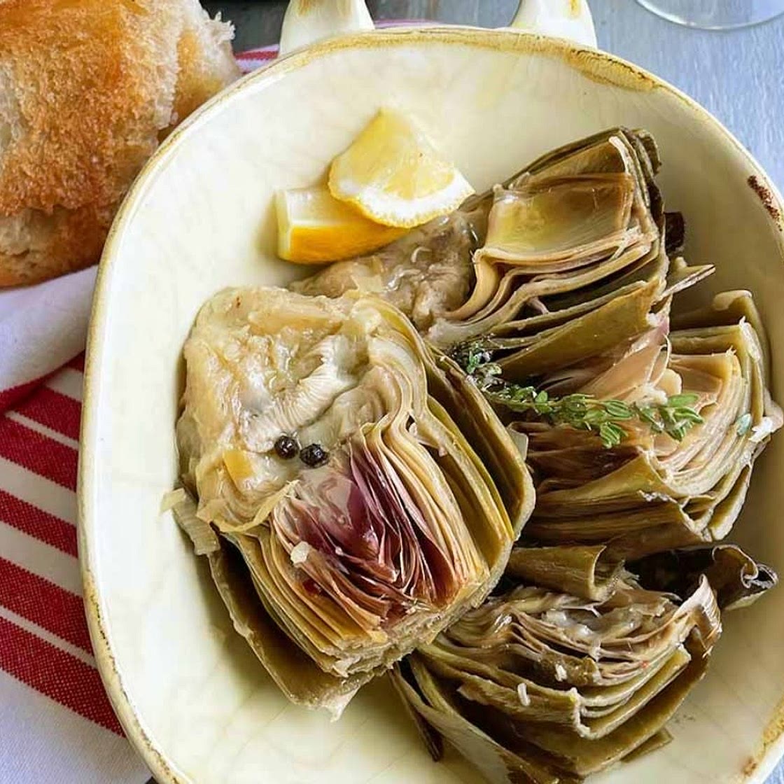 Slow cooked, lemon and garlic artichokes