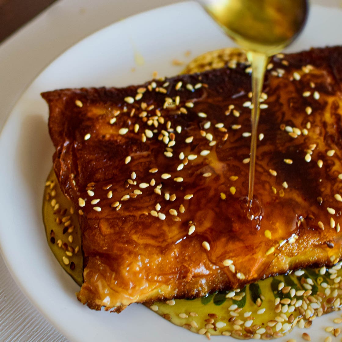 Feta Cheese Wrapped in Phyllo Pastry drizzled with honey and toasted sesame seeds