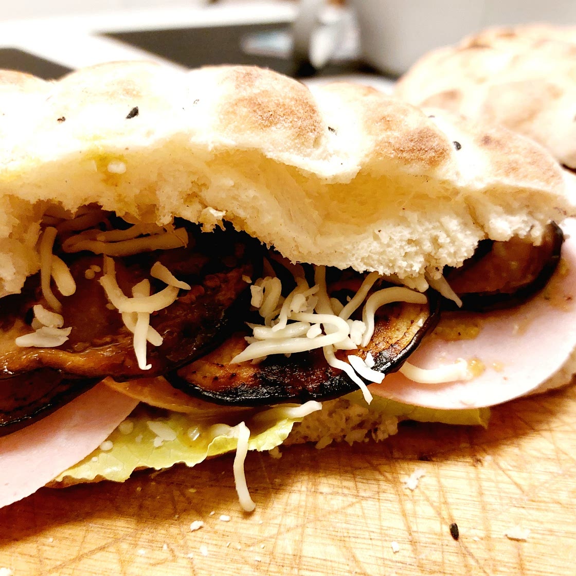 Panini - Eggplants, mortadella, pistachio cream and dried tomatoes