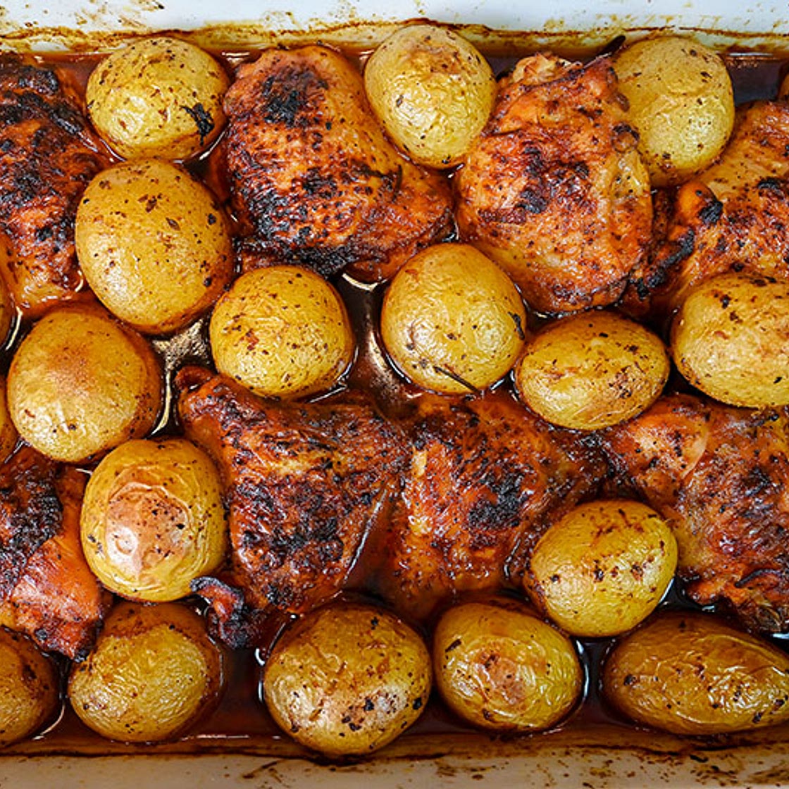Marinated Chicken Thighs And Potatoes Baked In The Oven